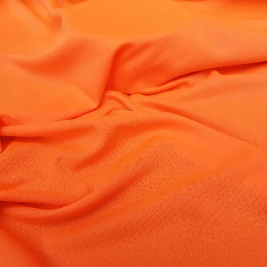 Ткань спортивная название. Спортивная ткань. Неоновый оранжевый ткань. Оранжевый неон цвет. Спортивный трикотаж ткань.
